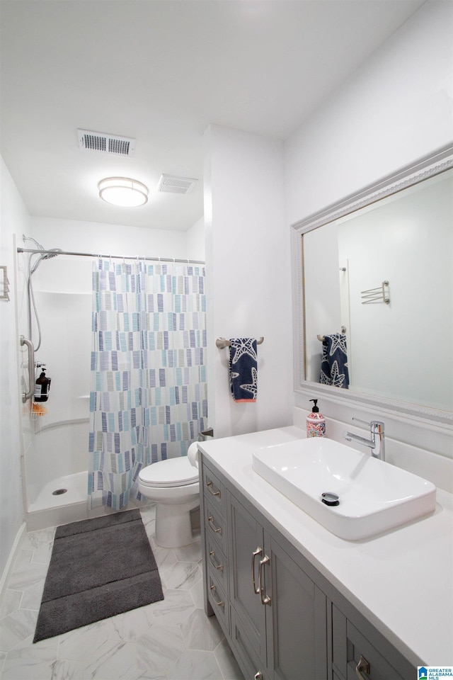 2009 Crossvine Rd, Hoover, AL 35244 - full bathroom featuring a shower with shower curtain, toilet, vanity, and marble look tile flooring