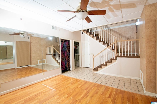 2009 Crossvine Rd, Hoover, AL 35244 - below grade area featuring stairs, ceiling fan, wood finished floors, and baseboards