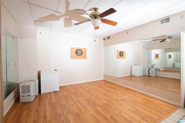 2009 Crossvine Rd, Hoover, AL 35244 - empty room featuring ceiling fan, light wood-style floors, a paneled ceiling, and baseboards