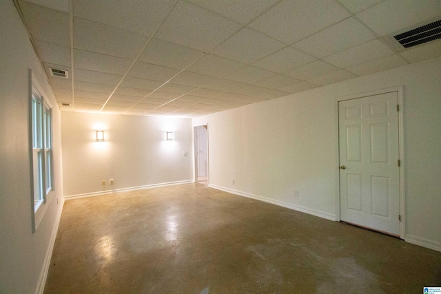 2009 Crossvine Rd, Hoover, AL 35244 - empty room featuring finished concrete floors, baseboards, and a drop ceiling