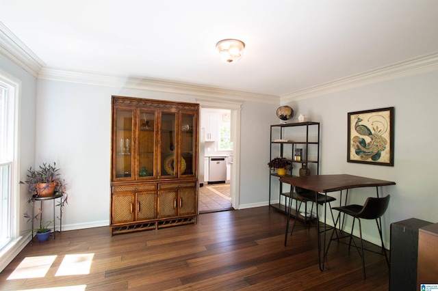 2009 Crossvine Rd, Hoover, AL 35244 - dining area with dark wood-style flooring, crown molding, and baseboards