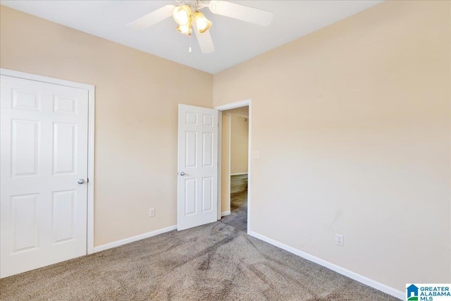 2250 Forest Lakes Ln, Sterrett, AL 35147 - unfurnished bedroom with carpet, baseboards, and a ceiling fan