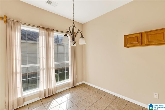 2250 Forest Lakes Ln, Sterrett, AL 35147 - unfurnished dining area featuring light tile patterned floors, a chandelier, and baseboards