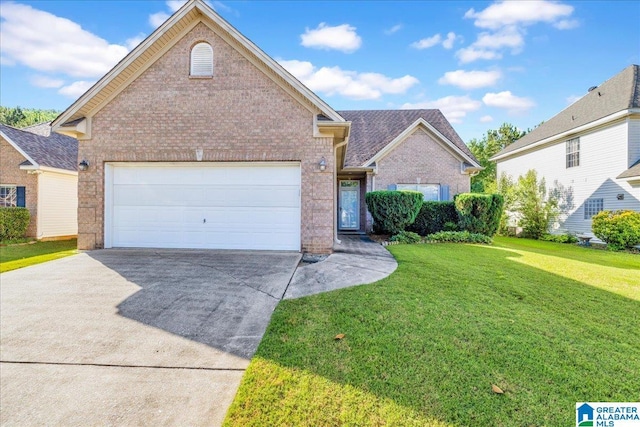 2250 Forest Lakes Ln, Sterrett, AL 35147 - traditional-style house with brick siding, concrete driveway, a front lawn, and a garage