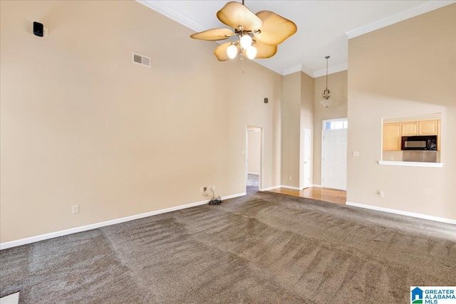 2250 Forest Lakes Ln, Sterrett, AL 35147 - unfurnished living room with ornamental molding, high vaulted ceiling, baseboards, carpet flooring, and ceiling fan