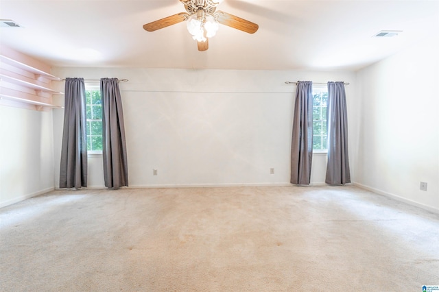 unfurnished room with ceiling fan, carpet, and baseboards