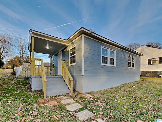 1424 33rd St, Ensley, Birmingham, AL 35218 - view of property exterior with covered porch and a yard