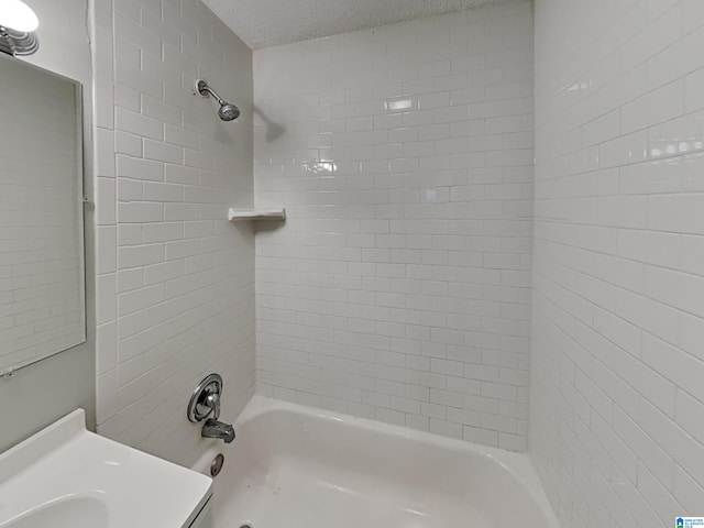 1424 33rd St, Ensley, Birmingham, AL 35218 - full bath with a textured ceiling,  shower combination, and vanity