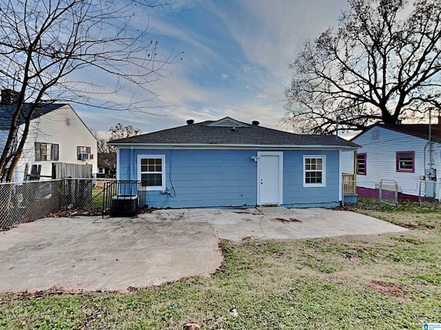 1424 33rd St, Ensley, Birmingham, AL 35218 - rear view of property featuring a patio and a shingled roof