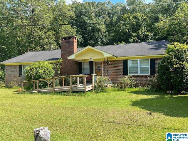 464 Hillside Cir, Childersburg, AL 35044 - ranch-style home featuring a front lawn, brick siding, and a chimney