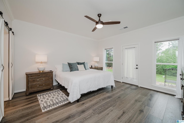 bedroom with ornamental molding, wood finished floors, access to outside, a barn door, and a ceiling fan
