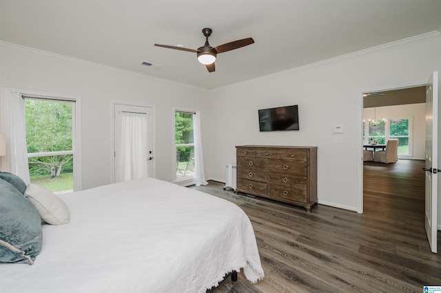 bedroom featuring ornamental molding, dark wood-type flooring, baseboards, and ceiling fan