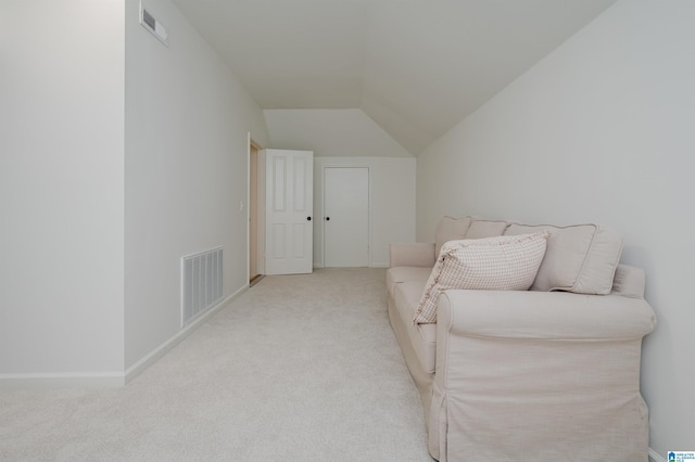 sitting room with carpet, vaulted ceiling, and baseboards