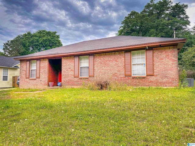805 N Court St, Prattville, AL 36067 - view of front of property with brick siding, central air condition unit, and a front yard
