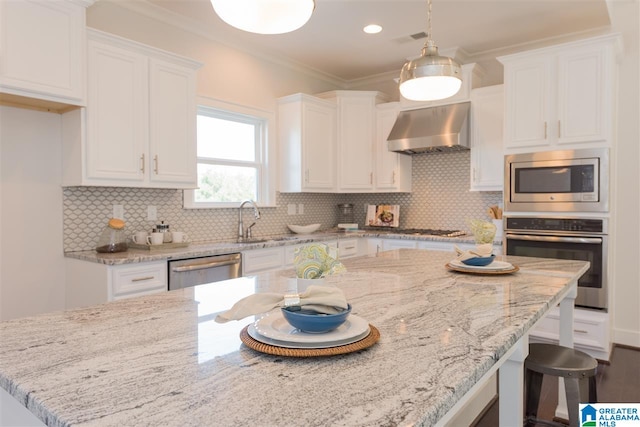 4731 Mcgill Ct, Hoover, AL 35226 - kitchen featuring stainless steel appliances, ventilation hood, white cabinets, a sink, and ornamental molding