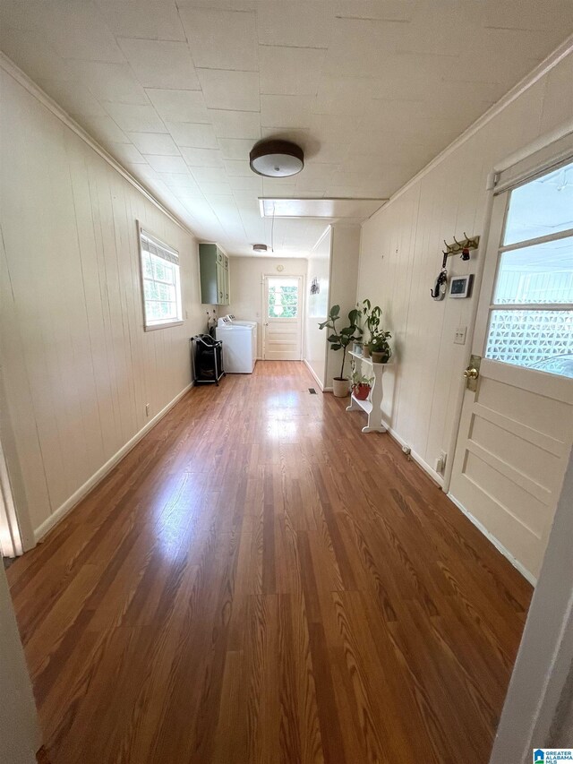 2020 Warrior Jasper Rd, Warrior, AL 35180 - living room with plenty of natural light, wood finished floors, crown molding, washer and clothes dryer, and baseboards