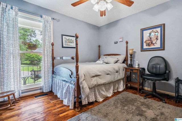 bedroom featuring wood finished floors and ceiling fan