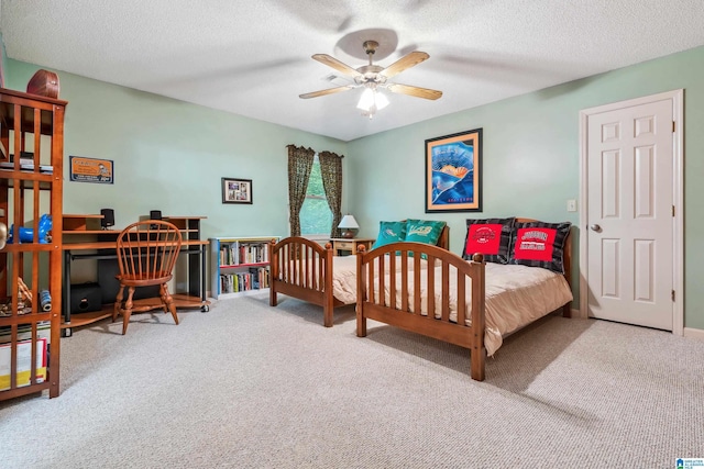 carpeted bedroom with a textured ceiling