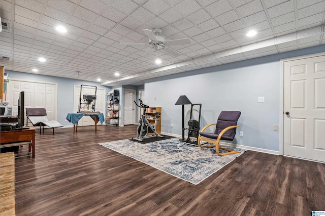 workout room featuring baseboards, wood finished floors, ceiling fan, and recessed lighting