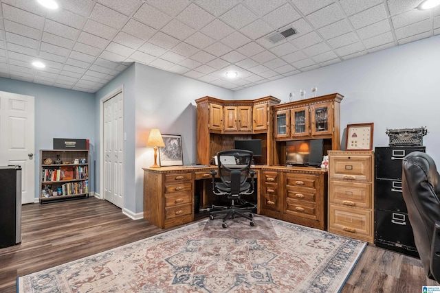home office with wood finished floors and baseboards