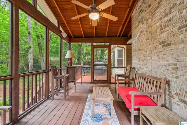 sunroom / solarium featuring ceiling fan and plenty of natural light