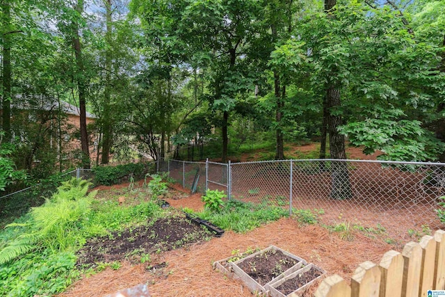 view of yard featuring a garden and fence