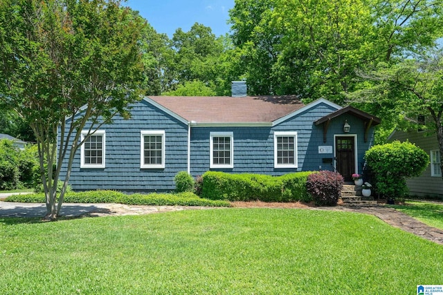 117 Morris Blvd, Homewood, AL 35209 - ranch-style house featuring a front yard and a chimney