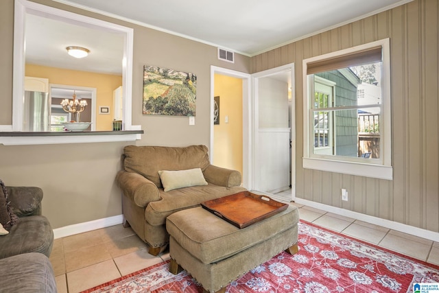 117 Morris Blvd, Homewood, AL 35209 - living area featuring baseboards, light tile patterned flooring, a chandelier, and ornamental molding