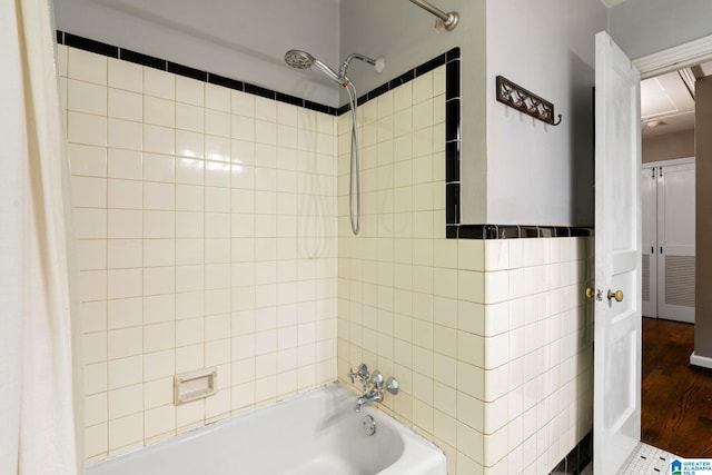 117 Morris Blvd, Homewood, AL 35209 - bathroom featuring shower / tub combo with curtain, tile walls, and wood finished floors