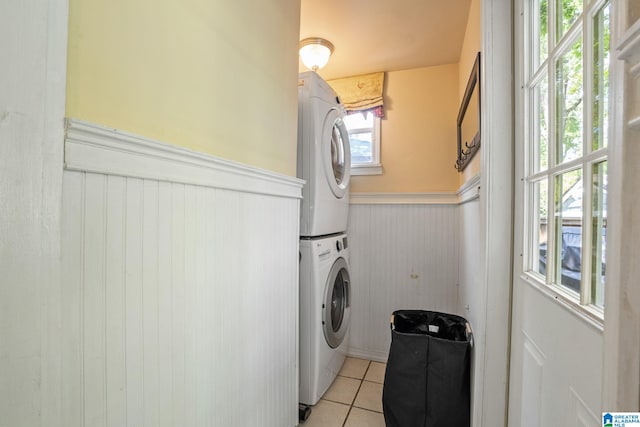 117 Morris Blvd, Homewood, AL 35209 - washroom featuring stacked washer and clothes dryer, wainscoting, and light tile patterned flooring