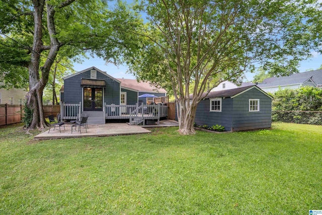 117 Morris Blvd, Homewood, AL 35209 - rear view of property featuring a deck, an outdoor structure, and a patio area