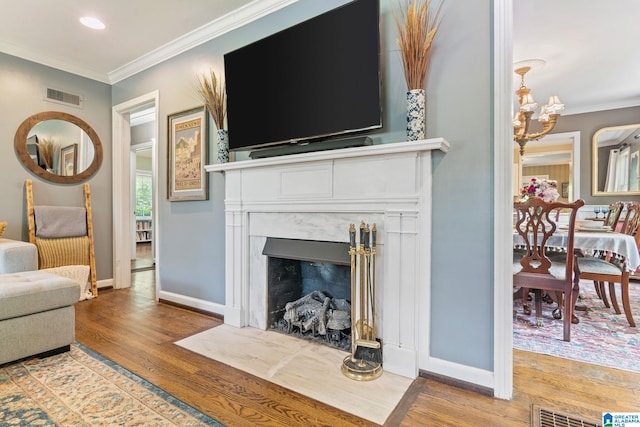 117 Morris Blvd, Homewood, AL 35209 - living area featuring wood finished floors, ornamental molding, baseboards, a fireplace, and recessed lighting