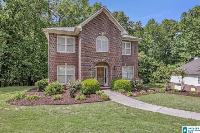 1408 W Acorn Way, Mount Olive, AL 35117 - colonial-style house with brick siding and a front yard
