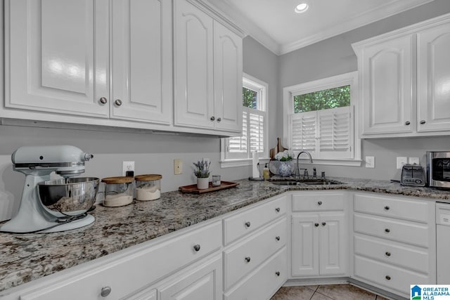 1408 W Acorn Way, Mount Olive, AL 35117 - kitchen with a sink, white cabinets, light stone countertops, light tile patterned flooring, and ornamental molding