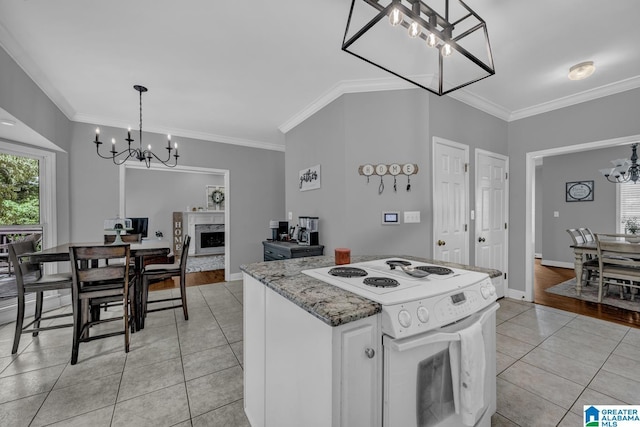 1408 W Acorn Way, Mount Olive, AL 35117 - kitchen with a chandelier, electric stove, light tile patterned flooring, ornamental molding, and a fireplace