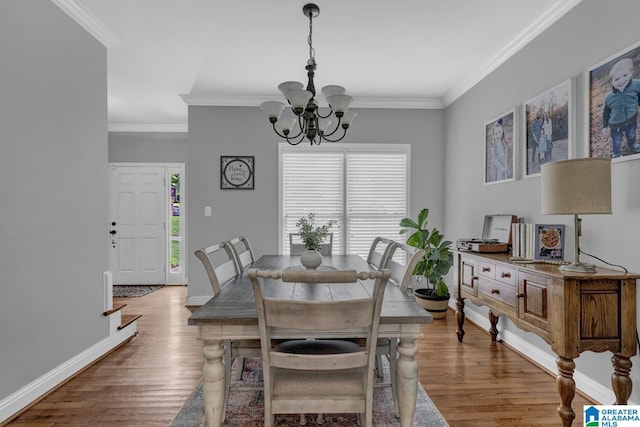 1408 W Acorn Way, Mount Olive, AL 35117 - dining room with a chandelier, ornamental molding, wood finished floors, and baseboards