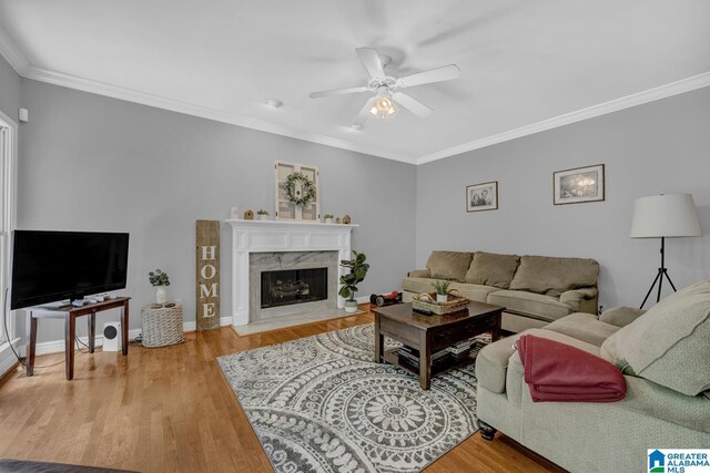 1408 W Acorn Way, Mount Olive, AL 35117 - living area featuring ornamental molding, ceiling fan, wood finished floors, a high end fireplace, and baseboards