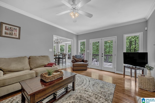 1408 W Acorn Way, Mount Olive, AL 35117 - living room with french doors, wood finished floors, crown molding, a chandelier, and ceiling fan