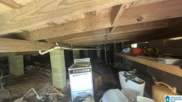 inside crawl space featuring white range with electric stovetop