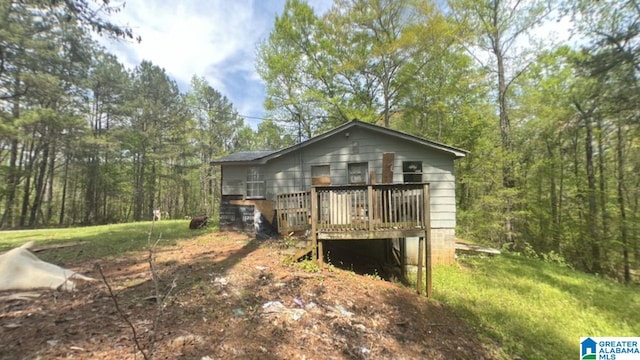 rear view of property with a wooden deck
