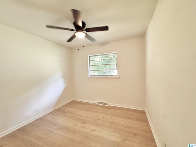 unfurnished room featuring light wood-style floors, ceiling fan, and baseboards