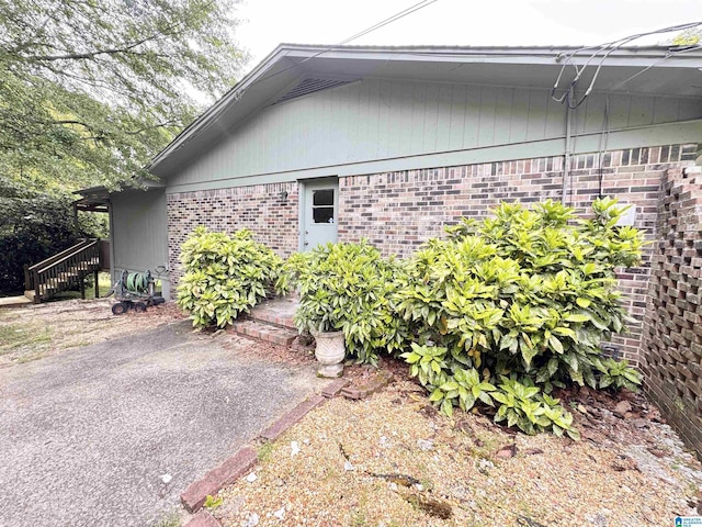 view of property exterior with brick siding