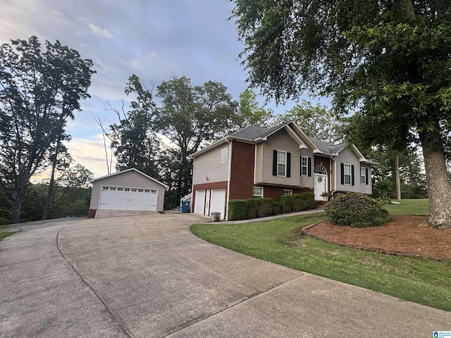 201 Paw Path Ln, Blountsville, AL 35031 - view of front facade with brick siding, a front yard, a garage, and an outbuilding