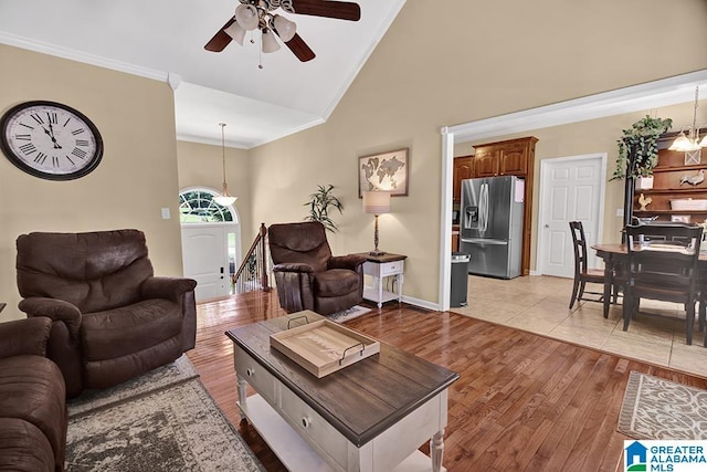 201 Paw Path Ln, Blountsville, AL 35031 - living area featuring a ceiling fan, crown molding, light wood-type flooring, baseboards, and high vaulted ceiling