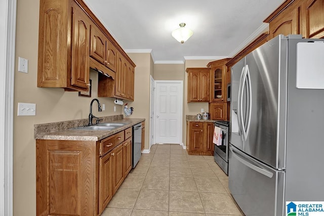 201 Paw Path Ln, Blountsville, AL 35031 - kitchen featuring appliances with stainless steel finishes, a sink, brown cabinetry, crown molding, and light tile patterned floors