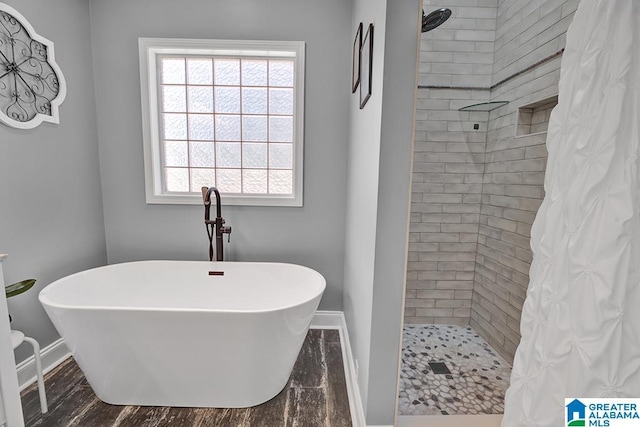 201 Paw Path Ln, Blountsville, AL 35031 - full bathroom featuring a tile shower, baseboards, and a freestanding tub