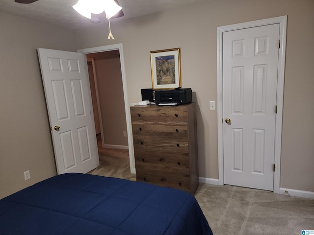 bedroom with carpet flooring and baseboards