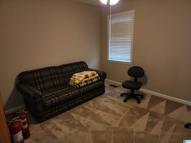 living area with carpet floors and baseboards