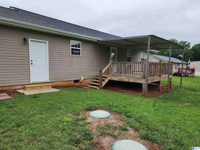 back of property with a wooden deck, a lawn, roof with shingles, and crawl space