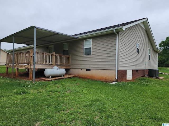 back of house with crawl space, a yard, a wooden deck, and central air condition unit